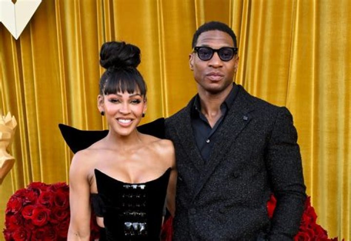 Jonathan Majors & Meagan Good's Awkward Red Carpet Kiss Causes Fan Debate