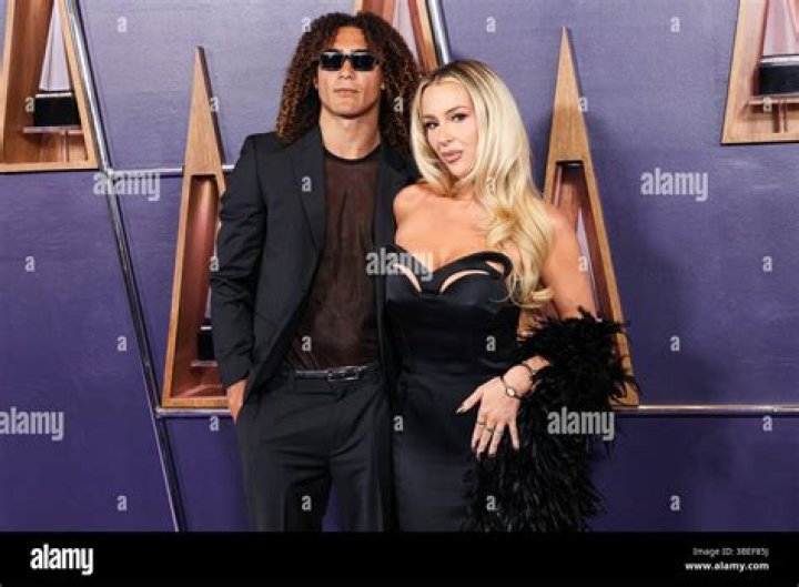 YouTuber Tana Mongeau Looks Hot While Tanning Makeup-Free in a Bikini … With Pockets?